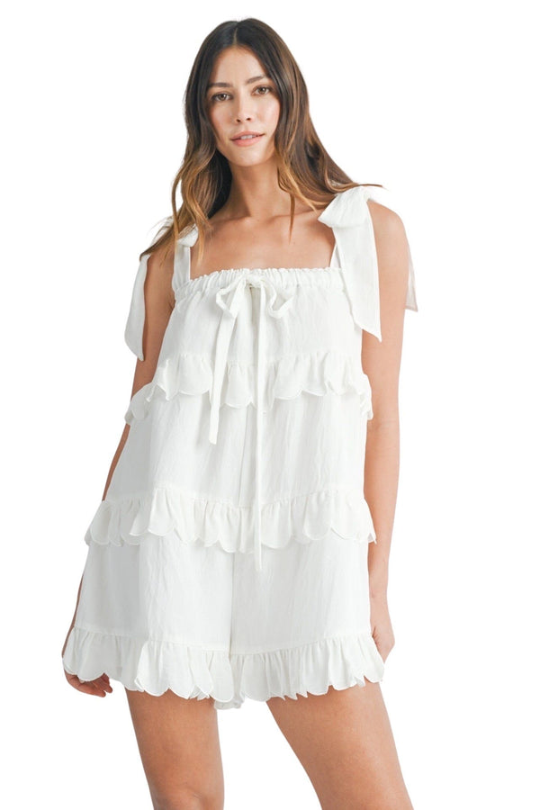 White ruffled tiered romper with scalloped trim