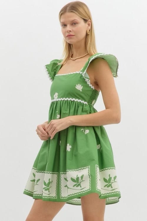 Green and white babydoll dress with Ric tac trim