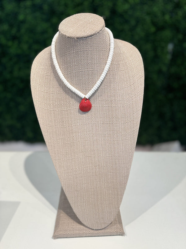 White rondelle necklace with red shell charm